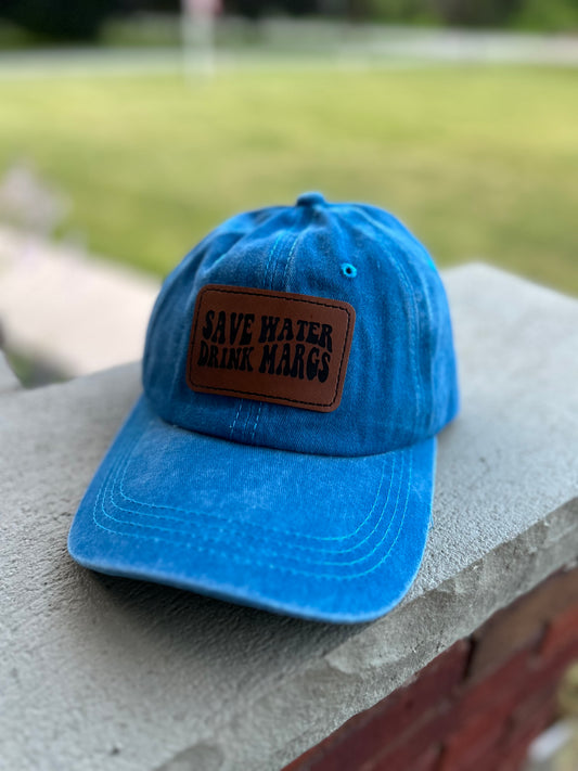 Bright blue ponytail hat with save water patch