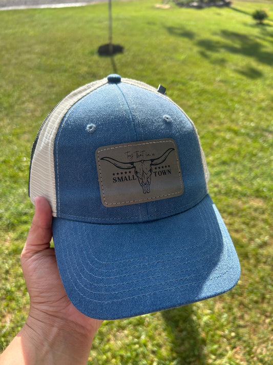 Blue hat with try that in a small town patch